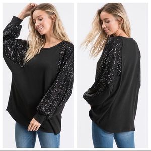 Sequence sleeve top in black.